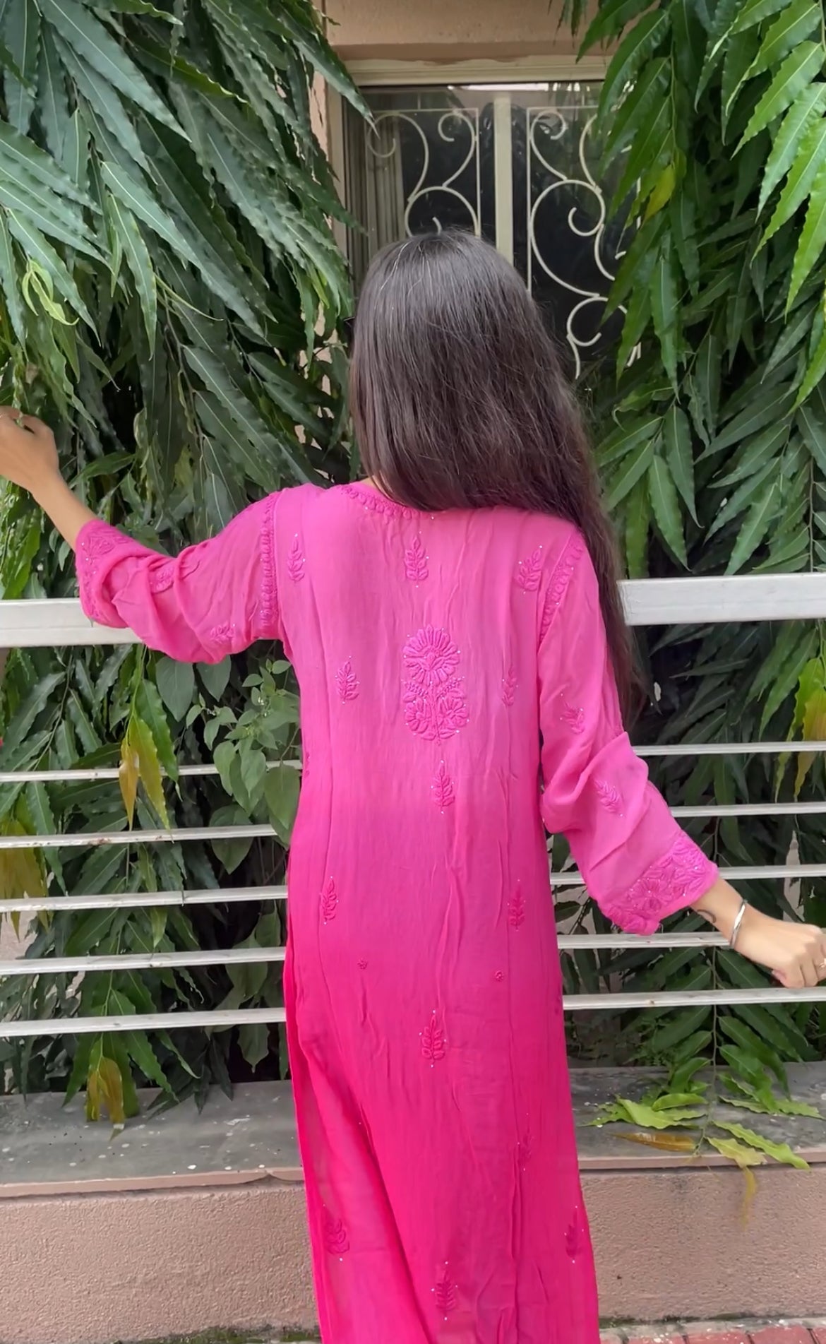 “Handcrafted Chikankari in a bold hot pink statement.”