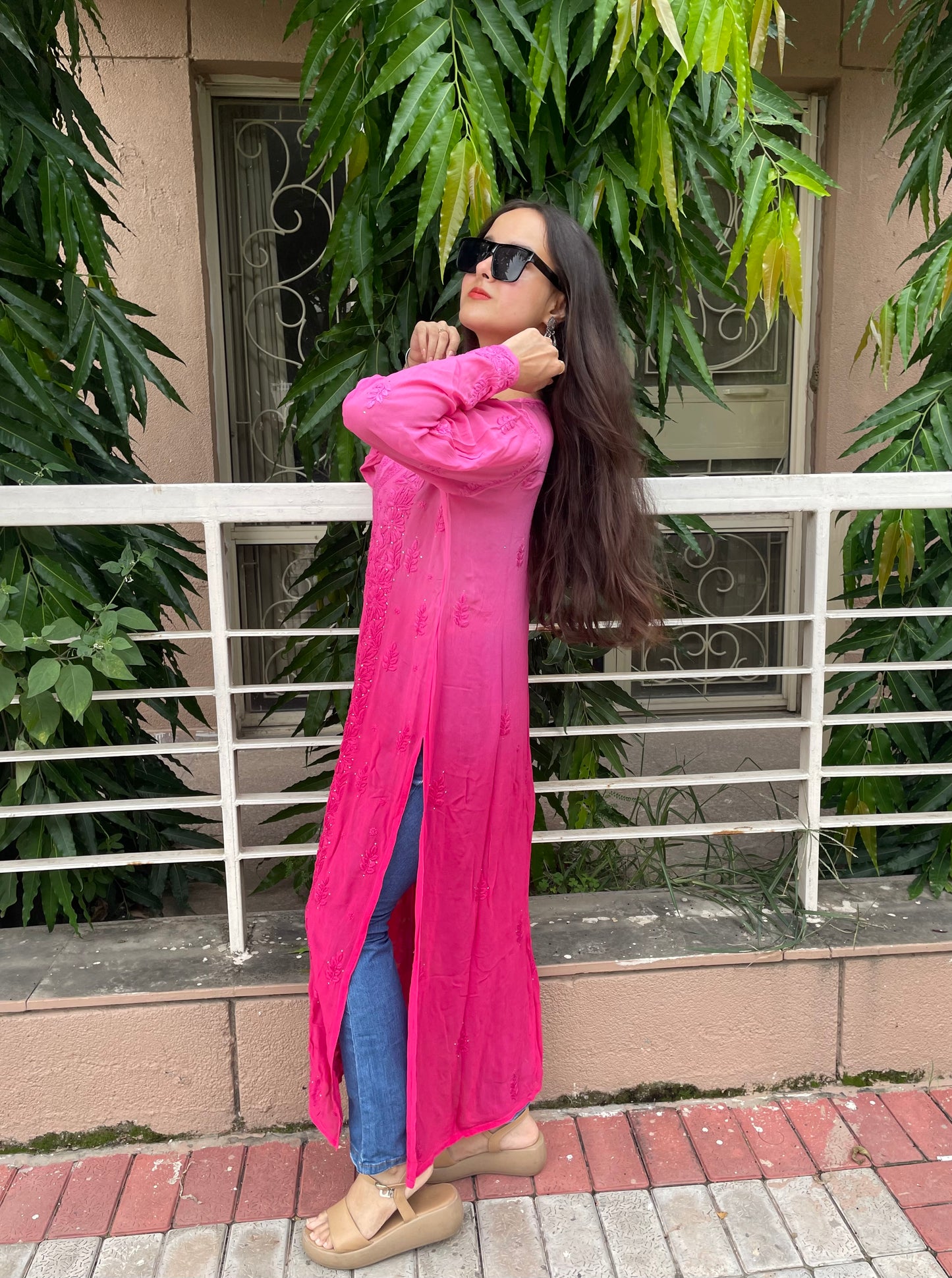 “Handcrafted Chikankari in a bold hot pink statement.”