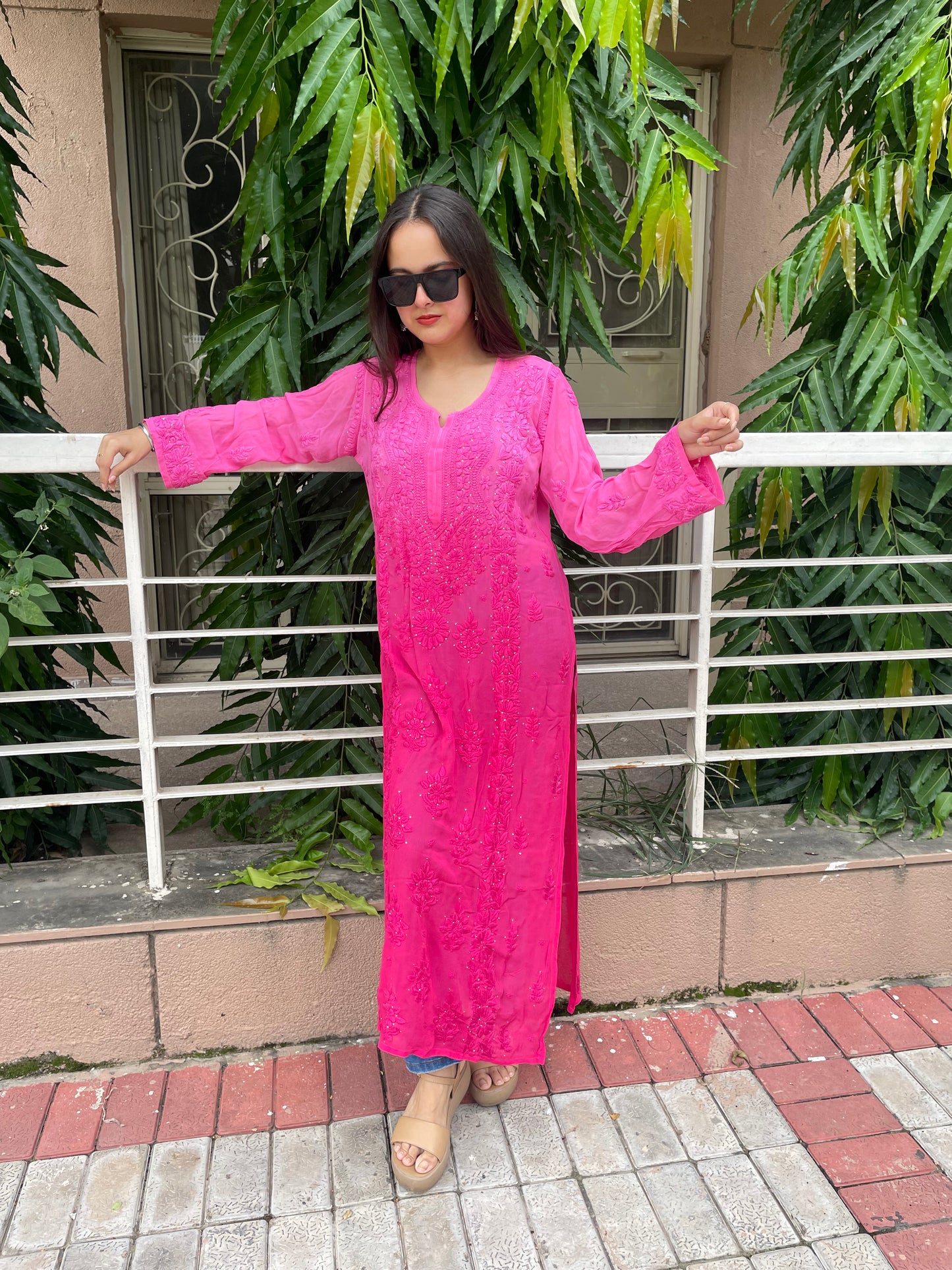 “Handcrafted Chikankari in a bold hot pink statement.”