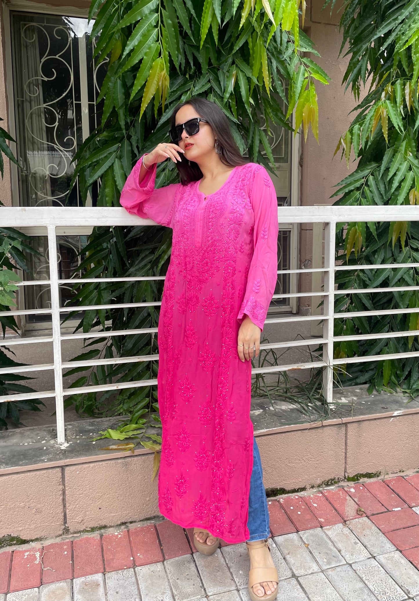 “Handcrafted Chikankari in a bold hot pink statement.”